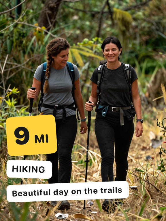 Two friends hiking with poles, tagged 9 MI, HIKING and the note “Beautiful day on the trails”